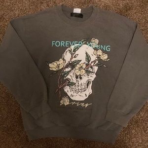 A grey skull sweatshirt with flowers from SHIEN.